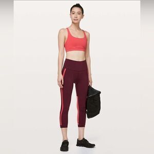 Lululemon Zip The Line Crop leggings 
Deep Ruby / Poppy Coral